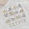 Accesorios para Uñas Artísticas Caja de 12 Compartimentos Mariposa Metálica Mixta Cuervo Corazón Cruz Cinta Lazo Decoración para Uñas de Forma Especial