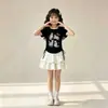 Conjunto de Duas Peças com Saia Texturizada de Cor Contrastante e Blusa de Manga Curta para Crianças Maiores, Novo Estilo de Verão, Roupa Estilo Princesa
