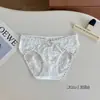 Ropa Interior de Encaje con Empalme Satinado Aceitoso de Venta Caliente para Mujer, Tentación Juvenil que Cubre la Cadera, Bragas Sexy de Cintura Media
