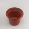 Fornecer flor artificial vaso de plástico 16cm vaso arranjo de flores com flor de grama barato flor de Qingming decoração de cemitério