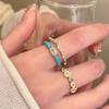 Anillo de apertura con flor de circón y gotas de aceite azul esmaltado para mujer, ligero, de lujo, con diseño de nicho superpuesto de alto nivel.