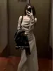 Conjunto de Otoño: un Conjunto Completo de Vestidos de Punto de Hombro Único de Gama Alta para Mujer en Otoño 2024 Nuevas Faldas Largas Ajustadas
