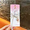 Llavero de campanilla de viento de gato creativo y lindo, colgante exquisito estilo Miu para bolso, llavero popular para regalo pequeño al por mayor