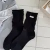 Calcetines de estilo ballet otoño/invierno estilo ins coreano puño suelto borde enrollado longitud hasta media pantorrilla adelgazantes tela de felpa JK etiqueta de tela estilo academia de huevo calcetines largos