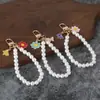 Nuevo colgante de llavero de coche de perlas, lindo accesorio para fundas de auriculares, decoración de bolso, accesorio de cadena colgante para equipaje para mujeres