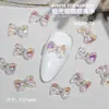 Popular en línea Aurora Hielo Lazo Decoración de Diamante para Uñas Todo Fósforo Resina Lazo Tridimensional Joyería para Uñas Venta al por Mayor