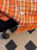 Camisa de rayas arrugadas de lujo ligero estilo coreano para hombre, camisa texturizada de manga corta holgada, camisa para ir al trabajo, naranja