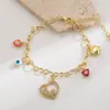 Pulsera de la Serie Ojo del Diablo Hip-Hop Exagerado Estilo Nuevo de He Ming con Colgante de Mariposa Corazón de Cobre y Diamante para Mujer