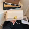 Bolsa de mão de luxo leve estilo coreano para atacado para mulheres, nova moda primavera 2026 bolsa de ombro com fecho de trava, bolsa transversal para o dia a dia
