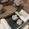 Anillo de Flor de Cuatro Hojas Giratorio Micro-Pavimentado con Circonita Superventas Transfronterizo Anillo en Vivo Flor de Molino de Viento Giratorio Anillo Pequeño Fresco para Mujeres