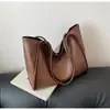 Bolsa de ombro para comércio exterior transfronteiriço para mulheres, novo modelo 2026, cor sólida, bolsa tote de grande capacidade, bolsa de trabalho estilosa e texturizada