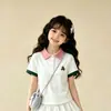 2026 Novo Verão Meninas Gola Polo Fina Manga Curta Doce Renda Bolo Saia Moda Conjunto de Duas Peças