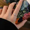 Anillo de camelia francés vintage de plata pura s999 para mujer, versátil y único, elegante anillo abierto de plata de ley al por mayor
