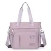 Bolsa de tela de nailon 2026 nuevo estilo de verano para mujer urbana simple bolso de mano de un solo hombro bolso tote cruzado casual para mujer