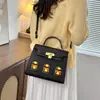 Bolsa feminina estilo luxo, novo modelo outono 2026, bolsa pequena tipo casa color block, bolsa de ombro e transversal moderna e única