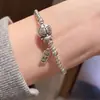 Popular en Xiaohongshu: Pulsera de Cuentas de Plata Doraemon Linda para Mujer, Pulsera de Cuentas de Plata Moda y Lujosa Gato que Suena Bolsa del Tesoro