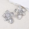 Transfronterizo Europa y Estados Unidos moda simple textura de pliegues irregulares aretes de flores creativos únicos mujeres viajeras diarias
