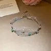 Pulsera de malla de alambre plateado tejida con perlas y cuentas de vidrio, diseño de nicho, lujo ligero, sensación de alta gama, accesorio para la mano