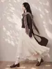 Elegante falda asimétrica reversible Feiyuan para mujer, nueva moda otoño e invierno, versátil, color liso, dobladillo ancho, falda midi