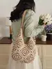 Llegada de verano de moda: un bolso tejido floral colorido, perfecto para vacaciones y la playa, un bolso de hombro casual