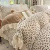 Novo conjunto de quatro peças de veludo de leite estilo preguiçoso com renda floral 2026