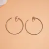 Aretes de Aro Redondos Geométricos Lisos Transfronterizos Europeos y Americanos para Mujeres Sin Perforaciones, Pendientes de Moda con un Toque de Lujo Ligero y de Gama Alta, Accesorios para Orejas al por Mayor