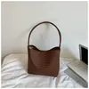 Bolsa tipo balde texturizada em trama retrô estilo coreano, nova coleção de verão 2026, design minimalista e único, adequada para o dia a dia, bolsa de ombro ou bolsa de axila