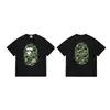 Producto exclusivo transfronterizo: Camiseta de manga corta de algodón puro BAPE camuflaje flor de cerezo tinta cabeza de mono co-branded NB Monte Fuji oso violento