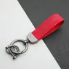 Colgante Llavero de Coche de Cuero Gamuzado Anillo de Resorte de Aleación de Zinc Cubierta de Llave Cadena de Llave con Logo de Coche Venta al por Mayor