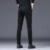 Jeans preto elástico Hong Kong para homens, corte slim, tendência primavera/outono 2026, calça social coreana