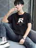 Venda Direta da Fábrica Camiseta de Manga Curta para Homem, Nova Tendência de Verão Marca Moda Camiseta de Cinco Mangas com Estampa de Letras, Gola Redonda Camiseta Versátil