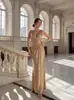 Moda Feminina Europeia e Americana Transfronteiriça Nova Primavera e Verão 2026 Vestido Sexy Decote Profundo Costas Nuas Dourado Lantejoulas de Alto Padrão Vestido de Festa