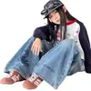 Pantalones vaqueros anchos estilo coreano de dibujos animados para niñas, nuevos y modernos jeans infantiles de otoño 2026