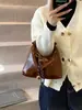 Bolso Retro Tipo Dumpling para Mujer Otoño e Invierno 2026 Nuevo Casual Versátil Cruzado Bolso de Mano Pequeño de Alta Gama Moderno