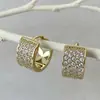Pendientes de superventas transfronterizos europeos y americanos, cierres de oreja de circonita de cobre, totalmente incrustados de diamantes, adecuados para ir al trabajo, con un toque de lujo ligero y de alta gama, pendientes para mujer
