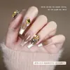 Celebridad en línea popular otoño e invierno Maillard K9 Marrón amarillo corazón torcido con forma de corazón punta inferior diamante uña zirconita decoraciones para uñas