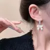 Pendientes de Perla con Lazo Blanco Leche Suave Pendientes de Diseño Elegante Accesibles de Lujo Francés Pendientes Dulces Versátiles para Mujer