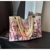 Bolsa de Hombro tipo Tote de Lona Transfronteriza para Mujer, Gran Capacidad, Nuevo Versátil Otoño e Invierno 2026, Bolsa para Clase de Estudiante Universitario