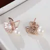 Versión coreana de pendientes de perla de flor de cerezo pendientes de circón chapados en oro real pendientes de diseño nicho pendientes de moda