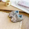 Zapatillas de suela blanda para bebé niña 2026 modelo nuevo estilo princesa lindo lazo de lunares Zapatillas de entrenamiento alemanas de moda