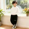 [En Stock] Pantalones Deportivos Hd para Niños 2026 Primavera y Otoño Nuevos Pantalones Deportivos para Niños con Bordado de Letras Pantalones Casuales para Niños