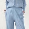 Pantalones plisados estilo Miyake Verano 2025 Nuevo Elástico Suelto Nueve puntos Cintura alta Slim Elegante Versátil Pantalones casuales