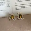 Pendientes tejidos circulares geométricos microincrustados, pendientes de moda retro de lujo ligero únicos de nicho