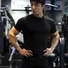 Nova Camiseta Esportiva Casual Americana de Manga Curta Masculina Verão Fitness Tops Treinamento Esportivo Camiseta Tops