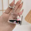 Llavero de Botella de Arena Líquida Negro Dorado Rellena de Aceite Acrílico de Moda Accesorio Colgante de Bolsas de TV de Conejito Lindo de Dibujos Animados