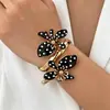 Pendientes de botón con lunares y flores clásicas francesas, versátiles, de moda, para mujer, accesorios de joyería, fuente de productos transfronterizos europeos y americanos