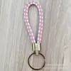 Llavero de cuerda de cuero trenzado simple creativo colgante de muñeca linda accesorios de llave para parejas tendencia regalos pequeños venta al por mayor