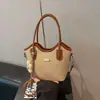Bolsa de mão feminina de nicho, novo modelo de primavera 2026, color-blocking, moderna e estilosa, toque de luxo, bolsa balde de ombro único e transversal