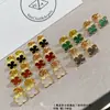Pendientes de Botón Mariposa Turquesa Versión Alta V Oro para Mujer Pendientes de Trébol de Cuatro Hojas Proceso CNC Borde Perlado Redondo Exquisito Estilo Pequeña Hada