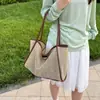 Bolso de paja tejido para mujer, gran capacidad, nuevo modelo 2026, bandolera versátil madre-hija, bolso de playa, bolsa de mano para el trabajo